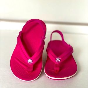 Like new fuchsia/pink crock sandals perfect for the pool or the beach.